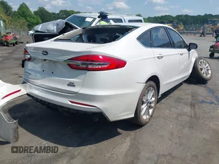 2020 Ford Fusion SE z VIN 3FA6P0LU5LR153942, wystawiony jako IAAI lot #42145638 z przebiegiem 99 961 mil mil oraz . Historia ofert i sprzedaży dostępna na DreamBid. Obrazek 4.