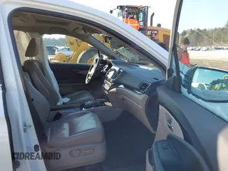 2020 Honda Pilot Elite with VIN 5FNYF6H09LB039247, listed as a IAAI auction lot 41364383 with 56,865 mi miles and . Bid and sale history available at DreamBid. Image 5.