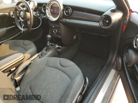 2012 MINI Coupe S z VIN WMWSX3C57CT155013, wystawiony jako Copart lot #88066275 z przebiegiem 69 870 mil mil oraz Szkody całkowita. Historia ofert i sprzedaży dostępna na DreamBid. Obrazek 8.