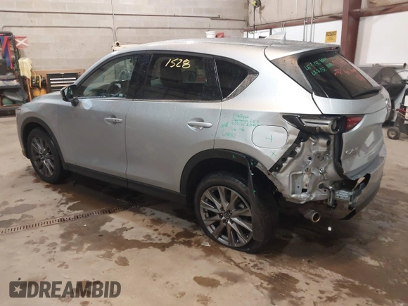 2021 Mazda CX-5 Grand Touring with VIN JM3KFADMXM1318015, listed as a IAAI auction lot 41221528 with 79,473 mi miles. Bid and sale history available at carsss.com. Image 3.