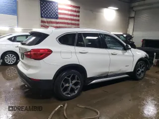 2016 BMW X1 xDrive28i with VIN WBXHT3C3XG5E51117, listed as a Copart auction lot 48243355 with 129,607 mi miles and Salvage Title. Bid and sale history available at carsss.com. Image 3.