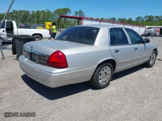2007 Mercury Grand Marquis GS with VIN 2MEFM74VX7X616232, listed as a IAAI auction lot 42043452 with 331,491 mi miles. Bid and sale history available at carsss.com. Image 4.