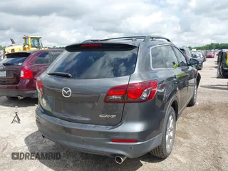 2015 Mazda CX-9 Touring with VIN JM3TB2CA7F0460232, listed as a IAAI auction lot 42344122 with 103,478 mi miles and . Bid and sale history available at DreamBid. Image 4.