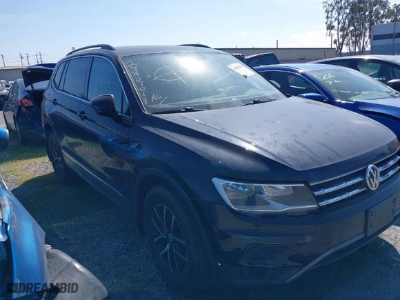 2021 Volkswagen Tiguan SE with VIN 3VV3B7AX0MM129887, listed as a IAAI auction lot 40565638 with 84,790 mi miles. Bid and sale history available at carsss.com. Image 1.