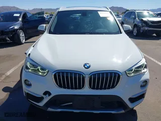 2017 BMW X1 xDrive28i with VIN WBXHT3C30H5F68187, listed as a IAAI auction lot 41830892 with 101,313 mi miles. Bid and sale history available at carsss.com. Image 12.