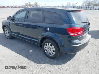 2014 Dodge Journey American Value Pkg with VIN 3C4PDCAB7ET101132, listed as a IAAI auction lot 41802381 with 101,895 mi miles. Bid and sale history available at carsss.com. Image 3.