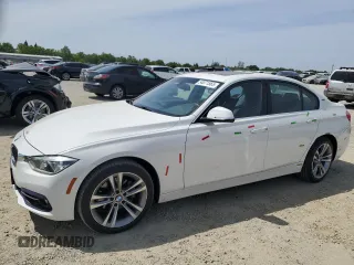2018 BMW 3 Series 330i xDrive with VIN WBA8D9G56JNU71570, listed as a Copart auction lot 54071565 with 73,305 mi miles and Salvage title. Bid and sale history available at DreamBid. Image 1.