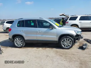 2013 Volkswagen Tiguan SE with VIN WVGAV7AX4DW545658, listed as a IAAI auction lot 41523168 with 188,729 mi miles and . Bid and sale history available at DreamBid. Image 14.