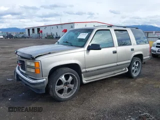 1999 GMC Yukon with VIN 1GKEK13R2XJ712390, listed as a IAAI auction lot 41793649 with 222,721 mi miles. Bid and sale history available at carsss.com. Image 18.