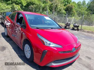 2019 Toyota Prius L Eco z VIN JTDKARFU1K3086702, wystawiony jako IAAI lot #42222336 z przebiegiem 56 167 mil mil oraz . Historia ofert i sprzedaży dostępna na DreamBid. Obrazek 1.