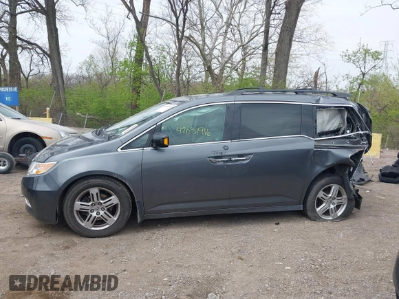 2012 Honda Odyssey Touring with VIN 5FNRL5H99CB028304, listed as a IAAI auction lot 42031916 with 216,185 mi miles and . Bid and sale history available at DreamBid. Image 15.