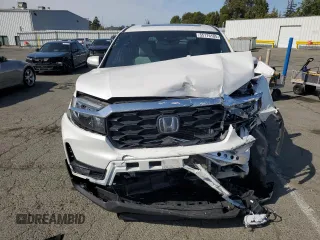 2023 Honda Passport EX-L with VIN 5FNYF8H58PB014241, listed as a Copart auction lot 55176105 with 16,672 mi miles and Salvage title. Bid and sale history available at DreamBid. Image 5.