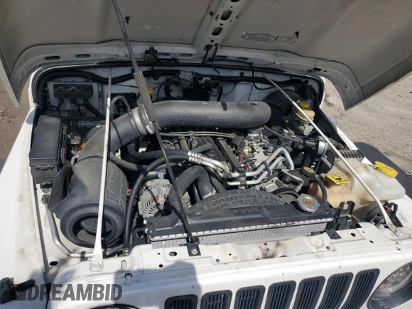 2003 Jeep Wrangler Rubicon z VIN 1J4FA69S73P333199, wystawiony jako Copart lot #50602615 z przebiegiem 133 254 mil mil oraz Szkoda całkowita • Salvage title. Historia ofert i sprzedaży dostępna na DreamBid. Obrazek 12.