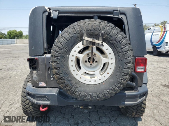 2016 Jeep Wrangler Rubicon z VIN 1C4BJWCG3GL275971, wystawiony jako Copart lot #60329125 z przebiegiem 25 956 mil mil oraz Szkoda całkowita • Salvage title. Historia ofert i sprzedaży dostępna na DreamBid. Obrazek 6.
