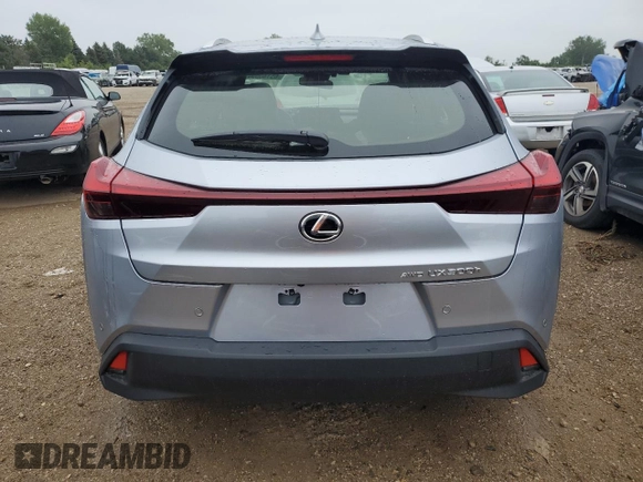 2025 Lexus UX with VIN JTHUCJDH3S2001129, listed as a Copart auction lot 65140554 with 875 mi miles and Salvage Title. Bid and sale history available at carsss.com. Image 6.