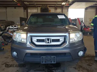 2010 Honda Pilot Touring with VIN 5FNYF4H89AB026005, listed as a IAAI auction lot 42118607 with 182,689 mi miles. Bid and sale history available at carsss.com. Image 12.