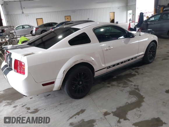 2007 Ford Mustang Deluxe with VIN 1ZVFT80N575259508, listed as a IAAI auction lot 41569259 with 164,315 mi miles. Bid and sale history available at carsss.com. Image 4.