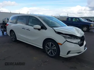 2022 Honda Odyssey Touring with VIN 5FNRL6H8XNB057293, listed as a IAAI auction lot 41826014 with 30,454 mi miles and . Bid and sale history available at DreamBid. Image 1.