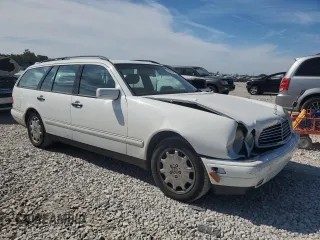 1999 Mercedes-Benz E-Class with VIN WDBJH65F1XA811693, listed as a Copart auction lot 69370604 with 128,876 mi miles and Salvage Title. Bid and sale history available at carsss.com. Image 4.
