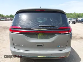 2023 Chrysler Pacifica Hybrid Touring L with VIN 2C4RC1L73PR522988, listed as a IAAI auction lot 42280263 with 54,939 mi miles and . Bid and sale history available at DreamBid. Image 16.