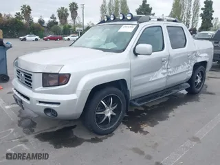 2006 Honda Ridgeline RTL with VIN 2HJYK16556H514349, listed as a IAAI auction lot 42076938 with 215,048 mi miles. Bid and sale history available at carsss.com. Image 2.