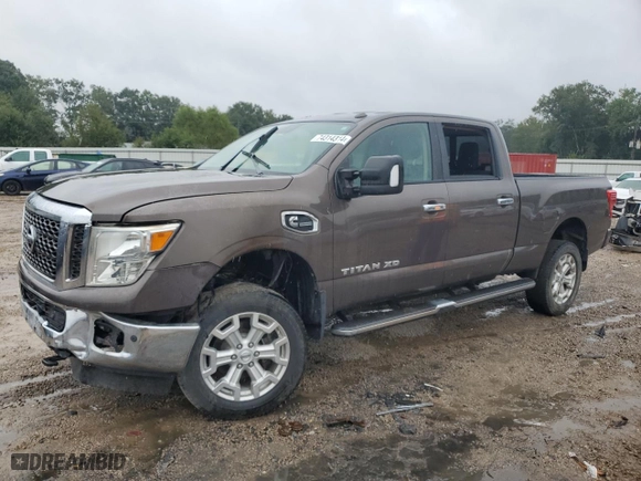 2016 Nissan Titan XD PRO-4X with VIN 1N6BA1F48GN517286, listed as a Copart auction lot 74314314 with 0 mi miles and Salvage Title. Bid and sale history available at carsss.com. Image 1.