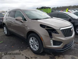 2023 Cadillac XT5 FWD Luxury z VIN 1GYKNAR45PZ140440, wystawiony jako IAAI lot #41723317 z przebiegiem 25 124 mil mil oraz . Historia ofert i sprzedaży dostępna na DreamBid. Obrazek 1.