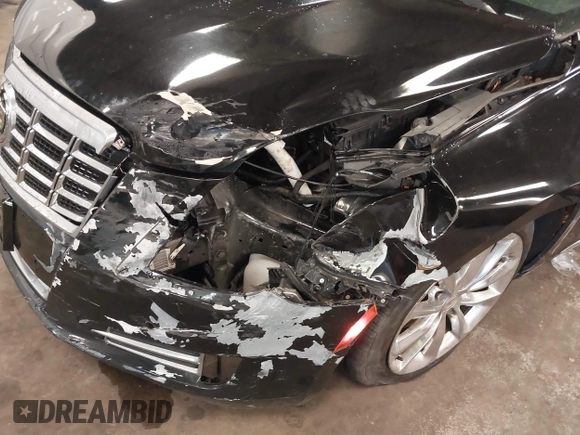 2013 Cadillac XTS Luxury z VIN 2G61R5S34D9102625, wystawiony jako IAAI lot #41668752 z przebiegiem 112 065 mil mil oraz . Historia ofert i sprzedaży dostępna na DreamBid. Obrazek 6.