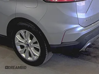 2020 Ford Edge Titanium z VIN 2FMPK4K91LBA91290, wystawiony jako IAAI lot #42494043 z przebiegiem 71 254 mil mil oraz . Historia ofert i sprzedaży dostępna na DreamBid. Obrazek 9.