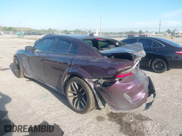 2021 Dodge Charger Scat Pack Widebody with VIN 2C3CDXGJXMH559036, listed as a IAAI auction lot 41895328 with 55,017 mi miles and . Bid and sale history available at DreamBid. Image 3.
