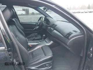 2005 BMW X5 4.8is with VIN 5UXFA93515LE82570, listed as a IAAI auction lot 41759657 with 212,687 mi miles. Bid and sale history available at carsss.com. Image 5.