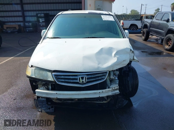 2002 Honda Odyssey EX z VIN 2HKRL18632H556791, wystawiony jako IAAI lot #41562553 z przebiegiem 222 976 mil mil oraz . Historia ofert i sprzedaży dostępna na DreamBid. Obrazek 13.