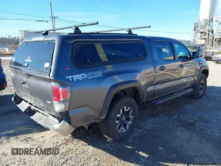 2021 Toyota Tacoma 4WD SR5 with VIN 5TFDZ5BN8MX058531, listed as a IAAI auction lot 41628820 with 102,004 mi miles. Bid and sale history available at carsss.com. Image 4.