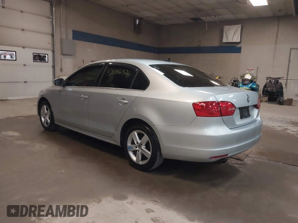 2014 Volkswagen Jetta TDI w/Premium with VIN 3VW3L7AJ6EM379401, listed as a IAAI auction lot 42086326 with 89,870 mi miles and . Bid and sale history available at DreamBid. Image 3.