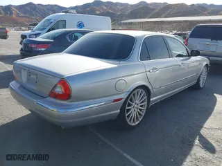 2004 Jaguar XJ with VIN SAJWA73B94TG30153, listed as a IAAI auction lot 41218841 with 91,158 mi miles. Bid and sale history available at carsss.com. Image 4.