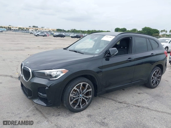 2021 BMW X1 sDrive28i with VIN WBXJG7C05M5U03116, listed as a IAAI auction lot 39837867 with 16,788 mi miles. Bid and sale history available at carsss.com. Image 2.