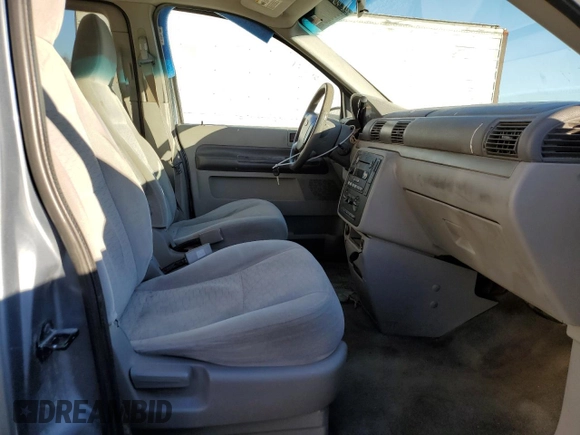 2005 Ford Freestar SE с VIN 2FMZA51675BA44440, выставлен на аукционе Copart как лот 86080294 с пробегом Не указан миль и Списание • Salvage title. История ставок и продаж доступна на DreamBid. Изображение 7.