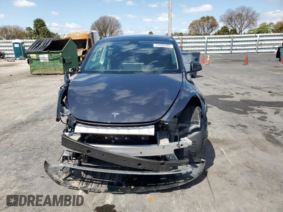 2025 Tesla Model Y Long Range with VIN 7SAYGDED8SF241779, listed as a Copart auction lot 51899205 with 12,409 mi miles and Salvage Title. Bid and sale history available at DreamBid. Image 5.