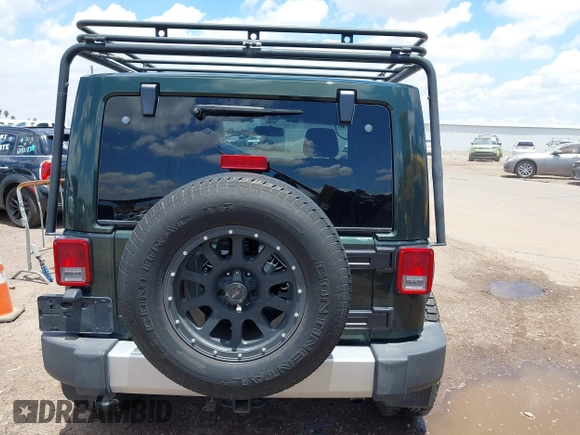2012 Jeep Wrangler Sahara z VIN 1C4AJWBGXCL100527, wystawiony jako IAAI lot #42394623 z przebiegiem 126 097 mil mil oraz . Historia ofert i sprzedaży dostępna na DreamBid. Obrazek 16.