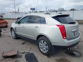 2014 Cadillac SRX Luxury Collection z VIN 3GYFNBE31ES628346, wystawiony jako IAAI lot #41709425 z przebiegiem 47 634 mil mil oraz . Historia ofert i sprzedaży dostępna na DreamBid. Obrazek 3.
