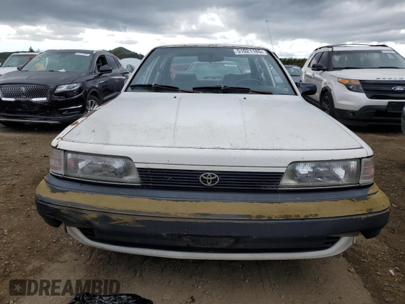 1991 Toyota Camry z VIN 4T1SV24E5MU355011, wystawiony jako Copart lot #51021185 z przebiegiem 135 881 mil mil oraz Czysty tytuł • Clean title. Historia ofert i sprzedaży dostępna na DreamBid. Obrazek 5.