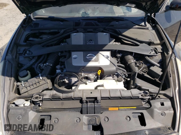2011 Nissan 370Z Touring z VIN JN1AZ4EHXBM553057, wystawiony jako Copart lot #58557165 z przebiegiem 110 714 mil mil oraz Szkoda całkowita • Salvage title. Historia ofert i sprzedaży dostępna na DreamBid. Obrazek 11.