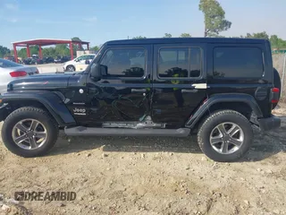 2021 Jeep Wrangler Unlimited Sahara with VIN 1C4HJXEG3MW536507, listed as a IAAI auction lot 41601893 with 51,214 mi miles and . Bid and sale history available at DreamBid. Image 14.