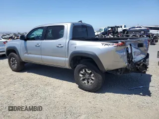 2018 Toyota Tacoma SR with VIN 3TMCZ5AN6JM129370, listed as a Copart auction lot 63042425 with 65,189 mi miles and Salvage title. Bid and sale history available at DreamBid. Image 2.