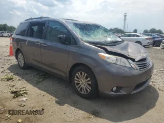 2015 Toyota Sienna XLE with VIN 5TDYK3DC6FS576670, listed as a Copart auction lot 62612345 with 106,475 mi miles and Salvage title. Bid and sale history available at DreamBid. Image 4.