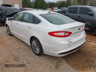 2013 Ford Fusion Titanium Hybrid with VIN 3FA6P0RU2DR308696, listed as a IAAI auction lot 41914944 with 133,710 mi miles. Bid and sale history available at carsss.com. Image 3.