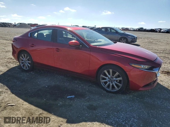 2019 Mazda 3 Premium with VIN 3MZBPAEMXKM103980, listed as a Copart auction lot 47821985 with 95,329 mi miles and Salvage Title. Bid and sale history available at DreamBid. Image 4.
