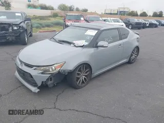 2014 Scion tC with VIN JTKJF5C71E3077886, listed as a IAAI auction lot 41939128 with 138,845 mi miles. Bid and sale history available at carsss.com. Image 2.