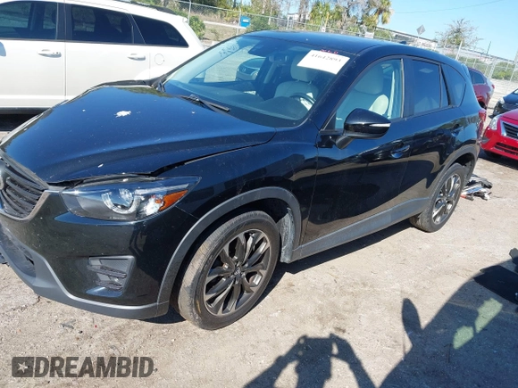 2016 Mazda CX-5 Grand Touring with VIN JM3KE4DY4G0677605, listed as a IAAI auction lot 41642893 with Not Provided miles and . Bid and sale history available at carsss.com. Image 17.