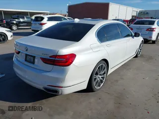 2018 BMW 7 Series 750i with VIN WBA7F0C57JGM23667, listed as a IAAI auction lot 41581035 with 113,140 mi miles and . Bid and sale history available at DreamBid. Image 4.